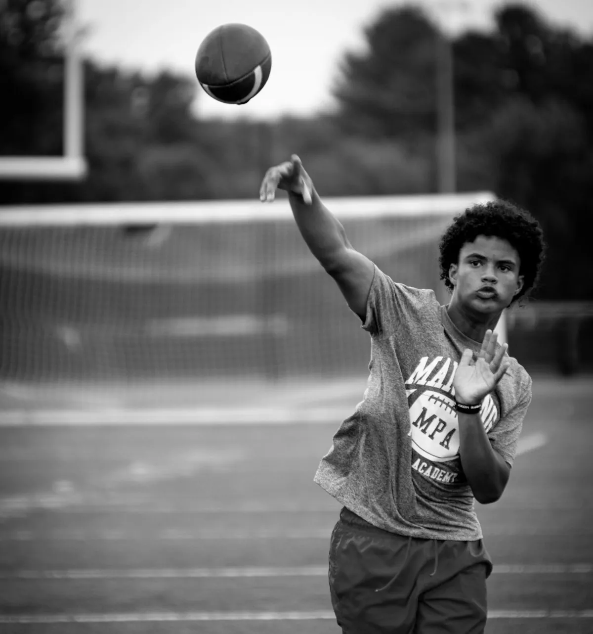 HAUS quarterback releasing a pass on the field